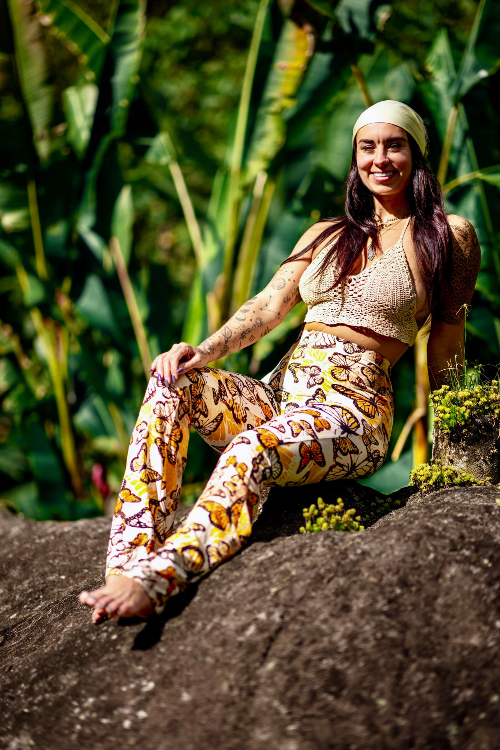 Kaitlyn seated among lush tropical plants in Costa Rica